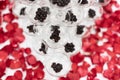 Selective focus of tapioca pearls in champagne glass pyramid tower decorated with rose petals on white cloth table Royalty Free Stock Photo