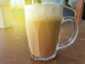 Selective focus of Tea with milk in a mug or popularly known as Teh Tarik in Malay language. Royalty Free Stock Photo