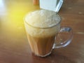 Selective focus of Tea with milk in a mug or popularly known as Teh Tarik in Malay language. Royalty Free Stock Photo