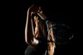 selective focus on tennis ball in the hand of woman who swung her racket to hit