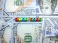 Selective focus of text STAY SAFE from colorful cube on face mask with banknote.