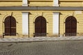 selective focus on three huge semi-circular wooden doors.