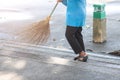 Selective focus to cleaning staff sweeping the floor with a broom Royalty Free Stock Photo