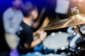 Selective focus to cymbals of drum set with blurry kid learning and play drum set with teacher in music room. The concept of Royalty Free Stock Photo