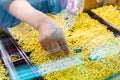 Selective focus to hand holding gold jewelry, customers are buying gold jewelry in the gold shop Royalty Free Stock Photo
