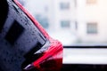 Selective focus to rain water drops on black car texture. Royalty Free Stock Photo