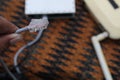 Selective focus to RJ45 Connector with crimping RJ45 tool on blurry background of UTP cable and computer network in computer room Royalty Free Stock Photo