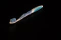 Selective focus on toothbrush isolated on black background Royalty Free Stock Photo