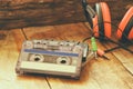 Selective focus of top view of vintage headphones and cassettes