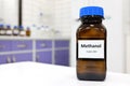 Selective focus of toxic methanol or methyl alcohol in glass bottle inside a laboratory. Royalty Free Stock Photo