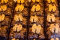 Selective focus of Turkish dessert with walnuts under the lights with a blurry background