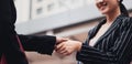 Selective focus of Two Businesswomen Shaking Hands and happy moment with new project In Modern Office Royalty Free Stock Photo