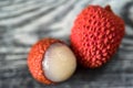 Two lychee fruits wooden background Royalty Free Stock Photo