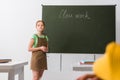 Selective focus of upset schoolgirl standing