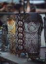 Selective focus vertical shot of the antique silver mugs at the bazaar