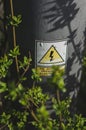 Selective focus vertical shot of a warning electrical hazard sign