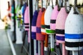Selective focus view of colourful fishing buoys hung along a building Royalty Free Stock Photo