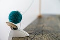 Close up view of a hand-operated knitting roll or wool thread ball winder and knitting umbrellla