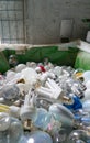 Selective focus view of large recycling bin filled with many different size and color light bulbs Royalty Free Stock Photo