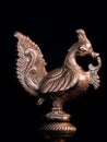 a vintage bird\'s statue made by bronze