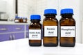 Selective focus of weak Formic, Acetic and Phosphoric acids in brown amber bottle. Royalty Free Stock Photo