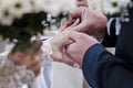 Selective focus on wedding ring. The bride and groom exchange rings during a wedding ceremony Royalty Free Stock Photo