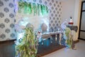 Selective focus of a wedding table with decorative swans flowers and a cake white and pink cake