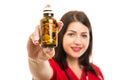 Selective focus of doctor wearing scrubs holding bottle of pills Royalty Free Stock Photo