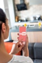 selective focus of woman using smartphone with youtube logo on screen Royalty Free Stock Photo