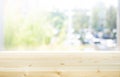 Selective focus.Wood table top on blur of window with garden background in morning.For montage product display or design key Royalty Free Stock Photo