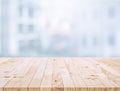 Selective focus of wood table top on white wall glass big window background Royalty Free Stock Photo