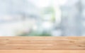 Selective focus of wood table top on white wall glass big window background Royalty Free Stock Photo