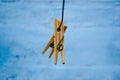 Selective focus of wooden clothespins hanging from the metal wire Royalty Free Stock Photo