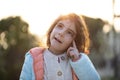 Little girl outdoor portrait with sunlight