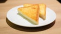 Selective focus of yellow or brown Grilled toast bread slices on white dish for breakfast Royalty Free Stock Photo