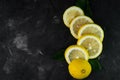 selective focus, yellow lemon rings on dark background Royalty Free Stock Photo