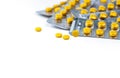 Selective focus on yellow tablets pill on blurred background of blister pack of round yellow pills. Diclofenac medicine Royalty Free Stock Photo