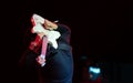 Selective focus on young Asian man guitarist`s hand performing playing electric guitar solo behind his back at concert Royalty Free Stock Photo