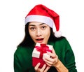 Selective focus Young beautiful asian woman wore green sweater and santa hat,Excited, surprised and happy, Holding a gift box with Royalty Free Stock Photo