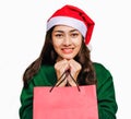 Selective focus Young beautiful asian woman wore green sweater and santa hat,Excited, surprised and happy, Holding a gift box with Royalty Free Stock Photo