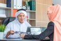 Selective focus of Young business arab middle eastern muslim meeting and working in office