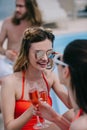 selective focus of young female friends drinking champagne and smiling Royalty Free Stock Photo