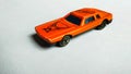 Closeup of orange toy car for children on white isolated background. Royalty Free Stock Photo