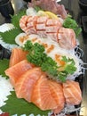 Selective focused on Japanese food cuisine gourmet: platter of sashimi fresh raw fish meat including salmon, fatty salmon, scall Royalty Free Stock Photo