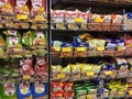 Selective focused of packed miscellaneous junk foods & snacks on rack and display for sale in the supermarket.