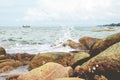 Sea water wave with stone rock of beach. Royalty Free Stock Photo