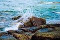 Sea water wave with stone rock of beach. Royalty Free Stock Photo