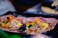 Selective focust to set of grilled Wagyu beef sushi with fish roe and Tobiko on black plate in Japanese restaurant