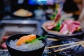 Selective focust to set of grilled Wagyu beef sushi with fish roe and Tobiko on black plate in Japanese restaurant