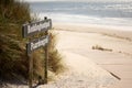 Selective of informative wooden signage to the beach